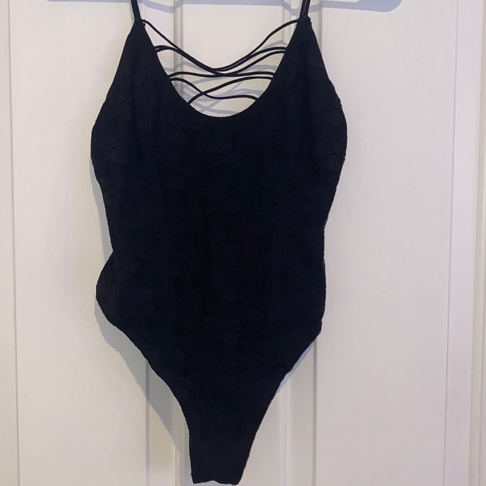 Floral lace bodysuit with criss cross strappy detailing